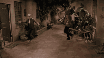 A mother and a daughter jumping around
