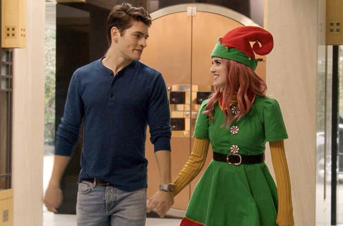 Kat Decker, dressed as an elf, and Dominic Wintergarden holding hands 