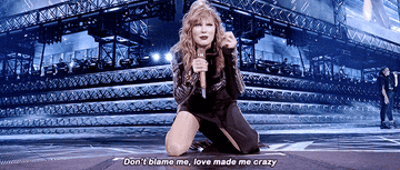 Taylor singing &quot;Don&#x27;t blame me, love made me crazy&quot; while slamming her hand down on her knees in the Reputation tour 