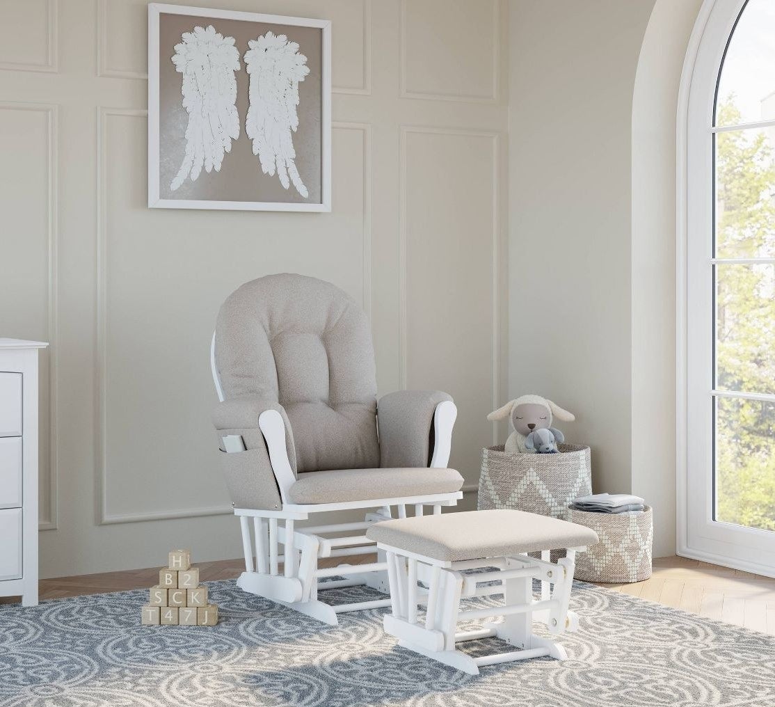 Glider and matching ottoman with white frame and taupe upholstery