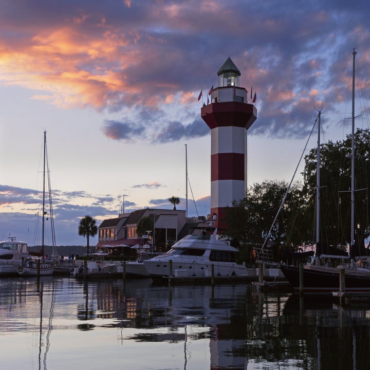 stripy Harbour Town lighthouse at sunset