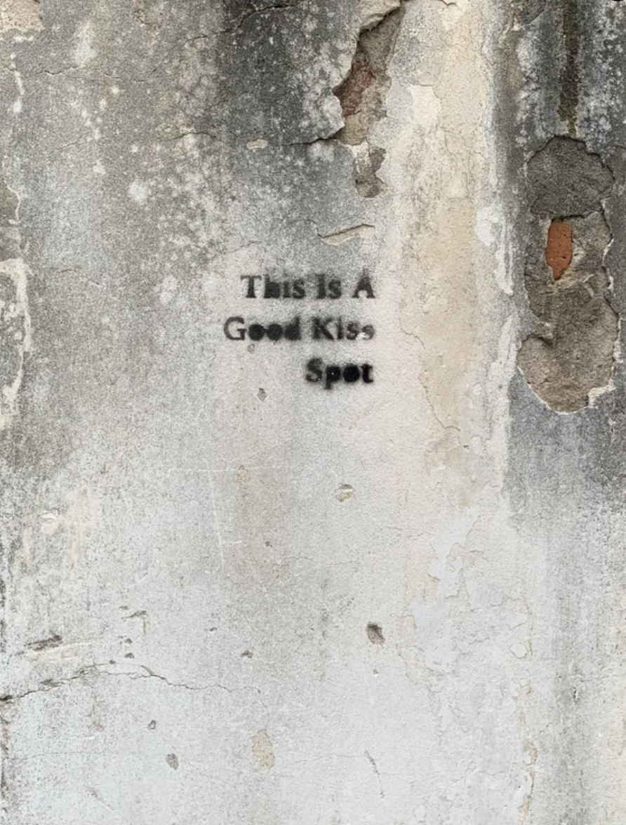 "This is a good kiss spot" has been scrawled on a wall