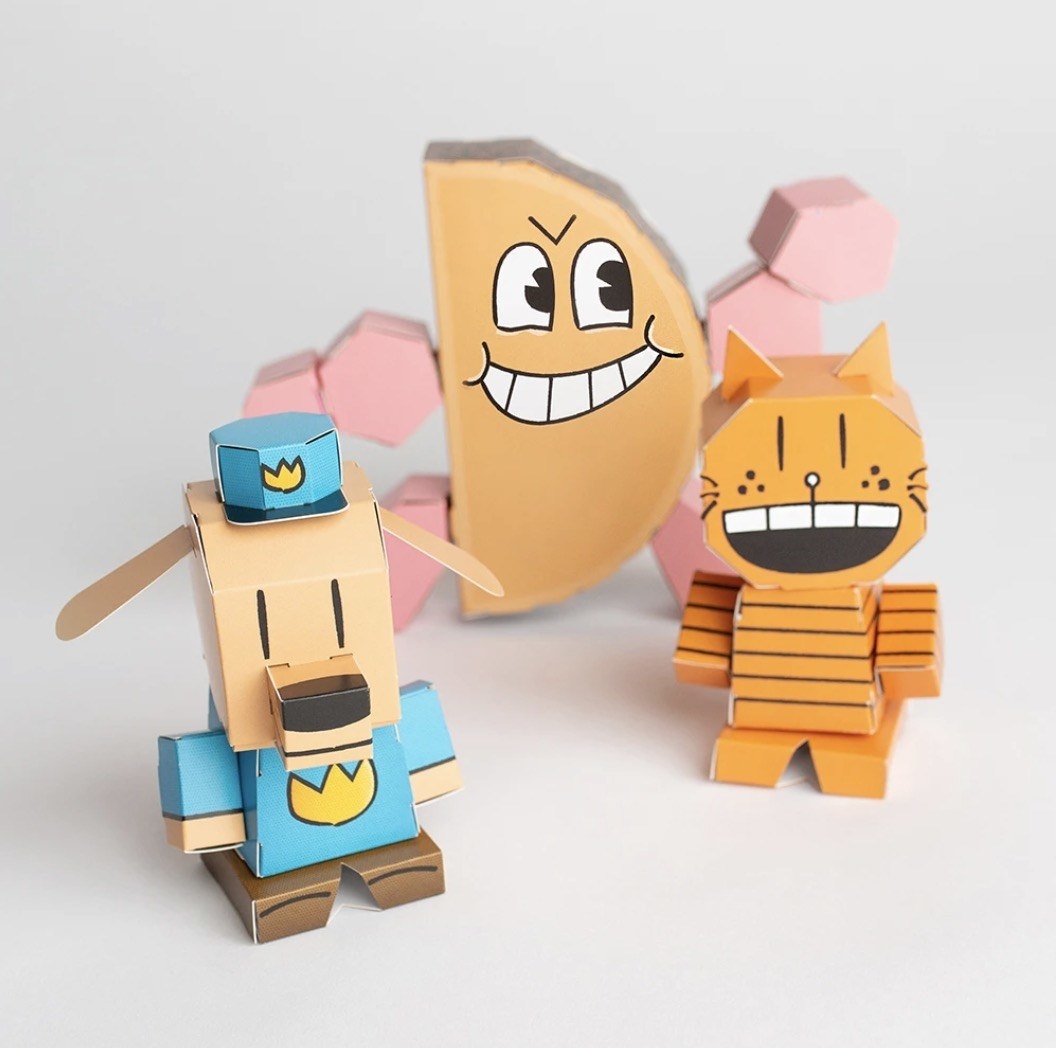 3d paper versions of a police dog, a taco, and cat