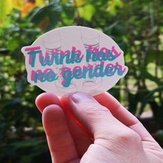 a hand holding the Twink has no gender sticker