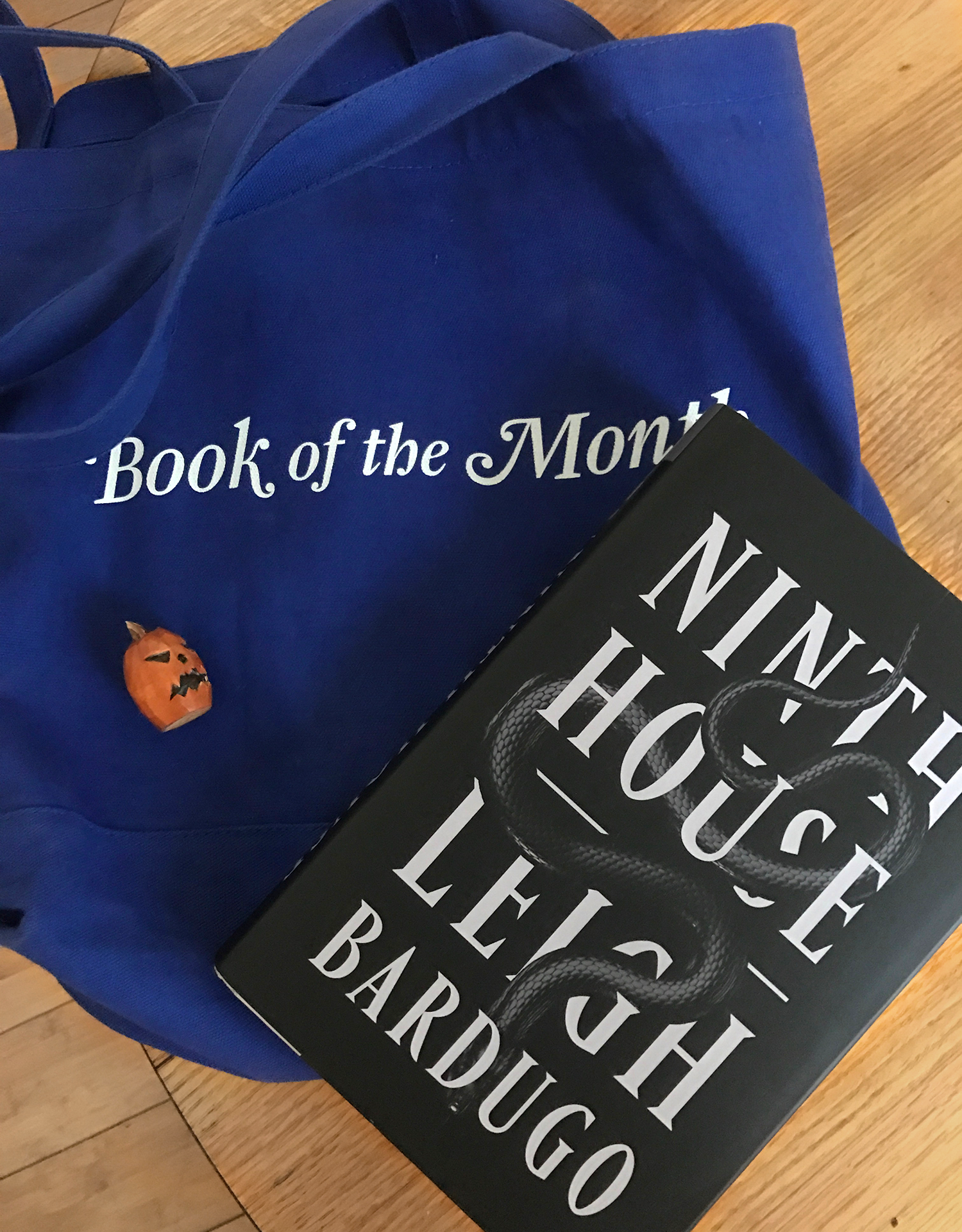 buzzfeed editor&#x27;s book of the month tote bag and the book ninth house by leigh barugo