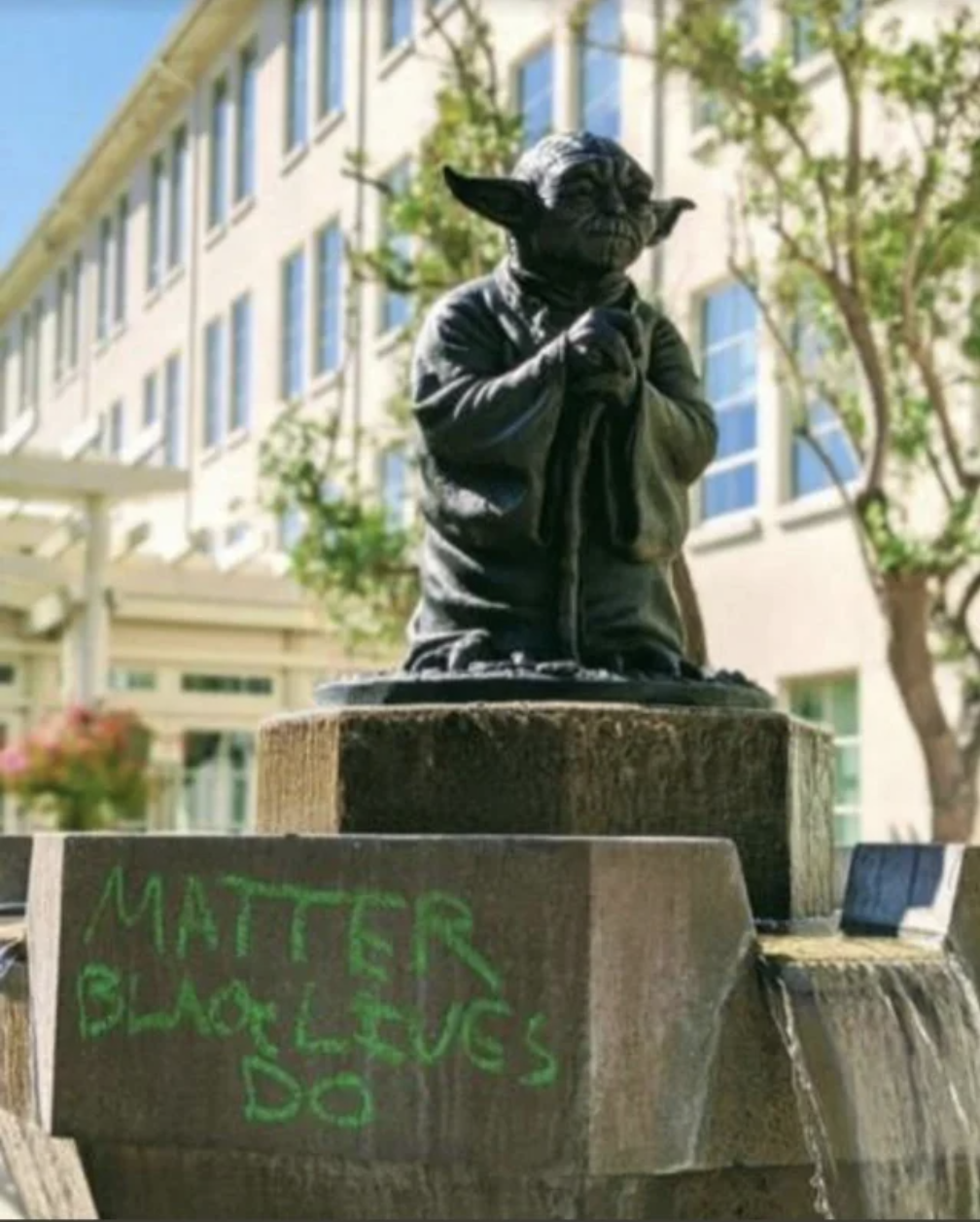"Matter, black lives do" has been spray-painted on a statue of yoda
