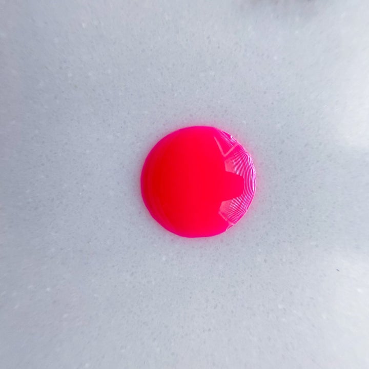 a drop of hot pink nail polish