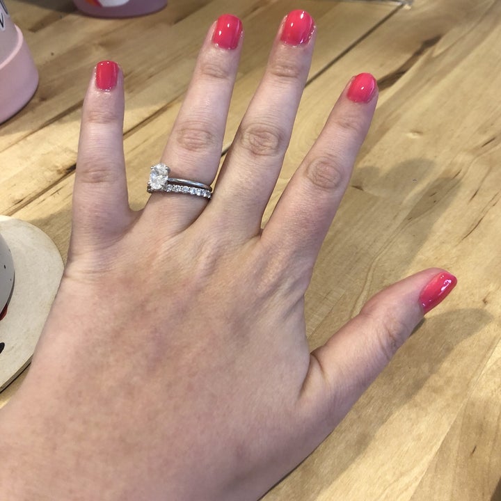 buzzfeed editor's hand with hot pink nail polish on