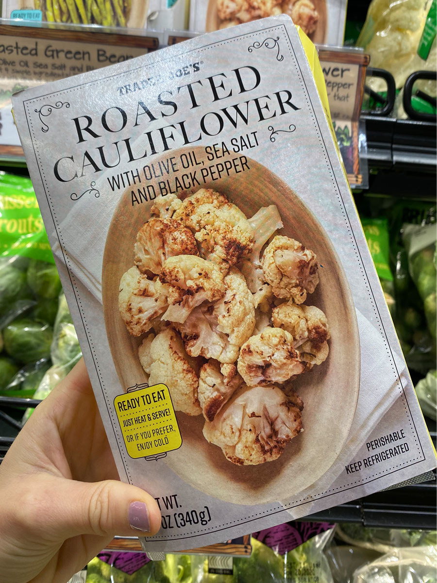 A box of roasted cauliflower with olive oil, sea salt, and black pepper.