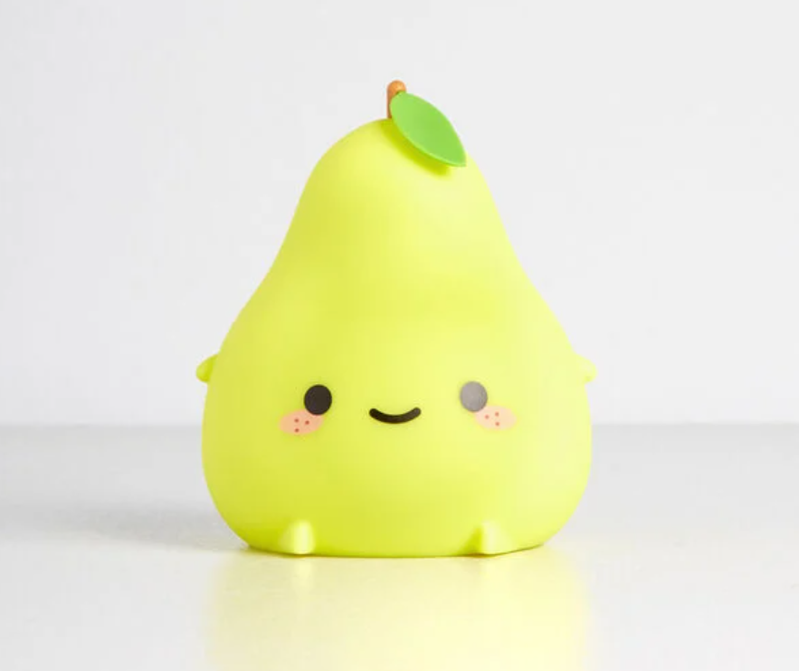 A pear-shaped night light on plain background