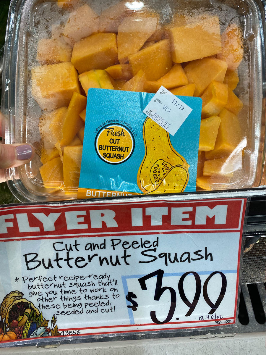 A container of cut and peeled butternut squash.