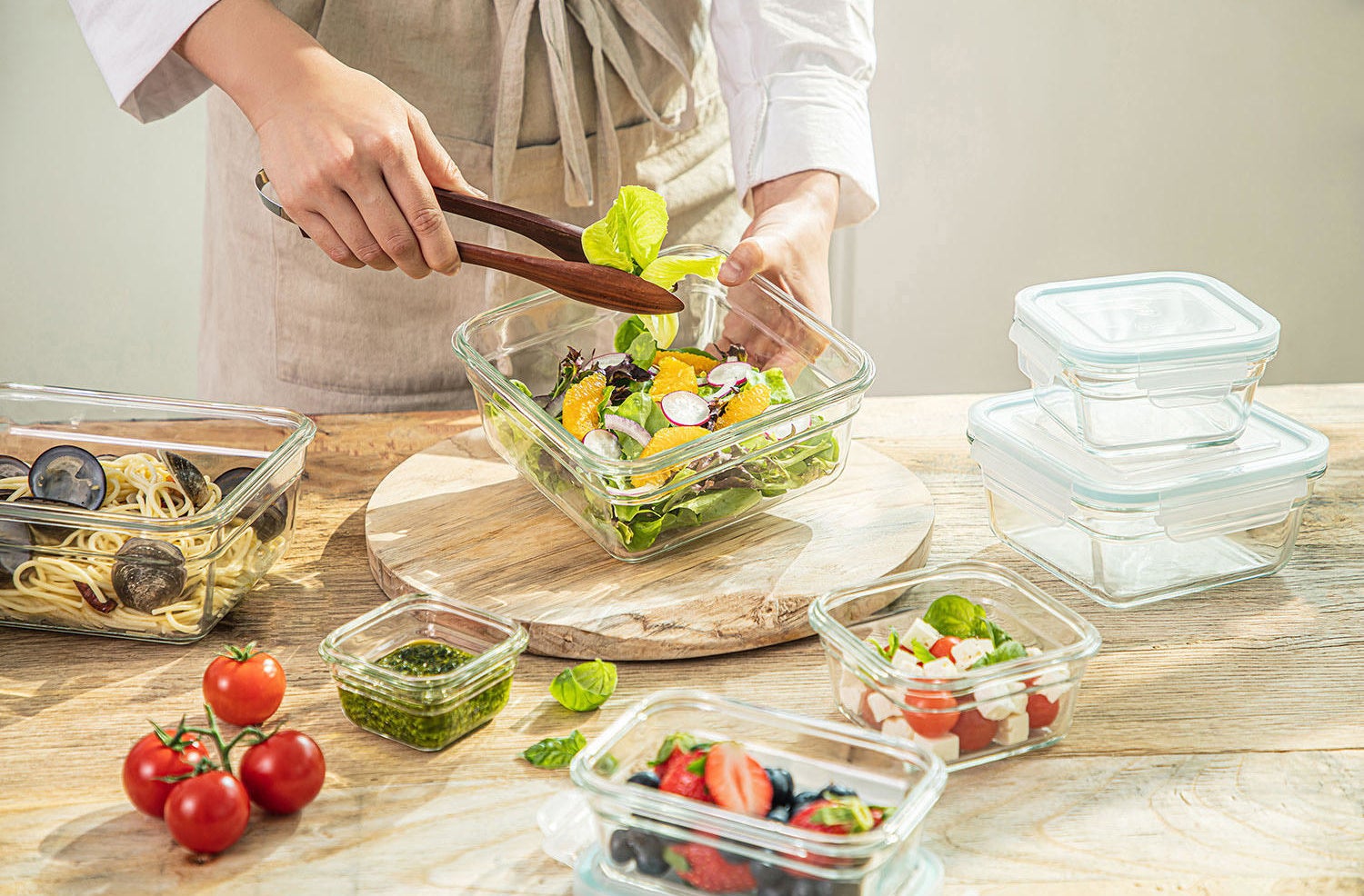 Assorted sizes of glass food containers with different food in them