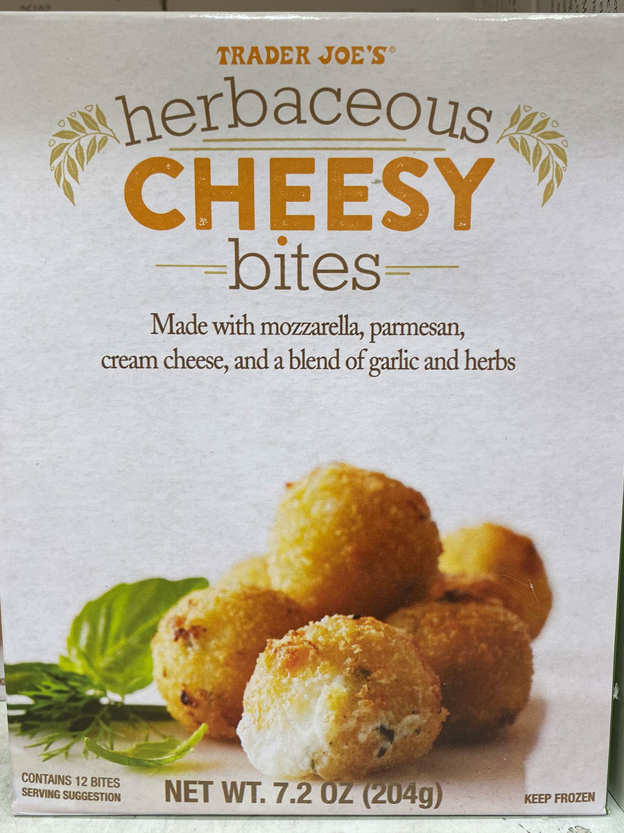 A box of frozen herbaceous cheesy bites.