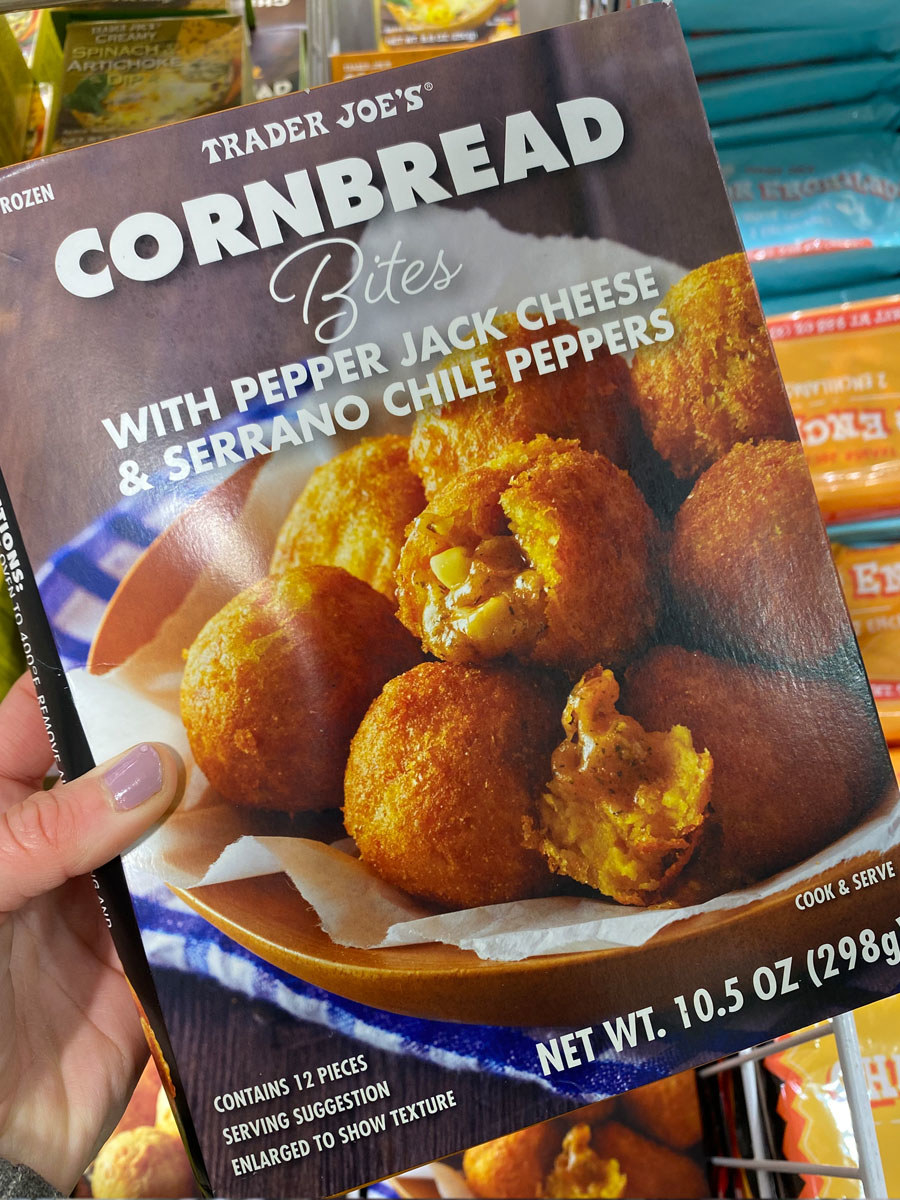 A box of cornbread bites filled with pepper jack cheese and chile peppers.