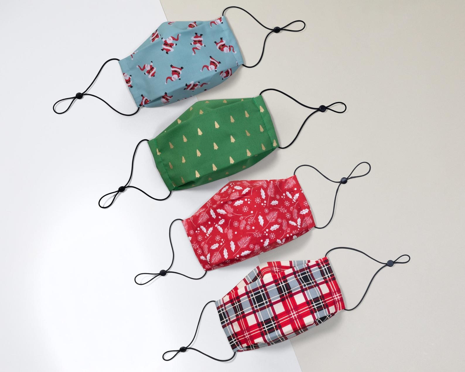 Masks in santa, christmas tree, holly, and plaid prints