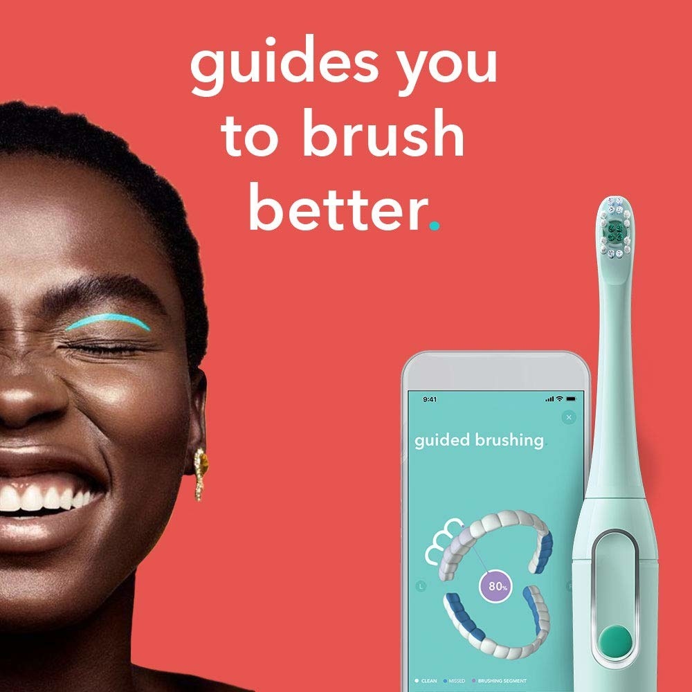 The teal toothbrush with a phone showing the app and text &quot;guides you to brush better&quot;