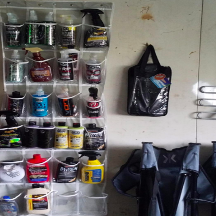 a reviewer's photo of the organizer storing car detailing products