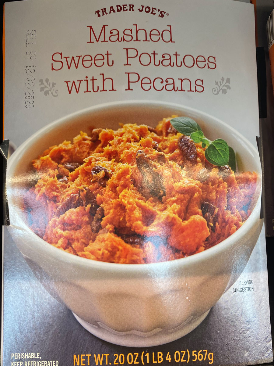 A box of sweet potatoes with pecans.