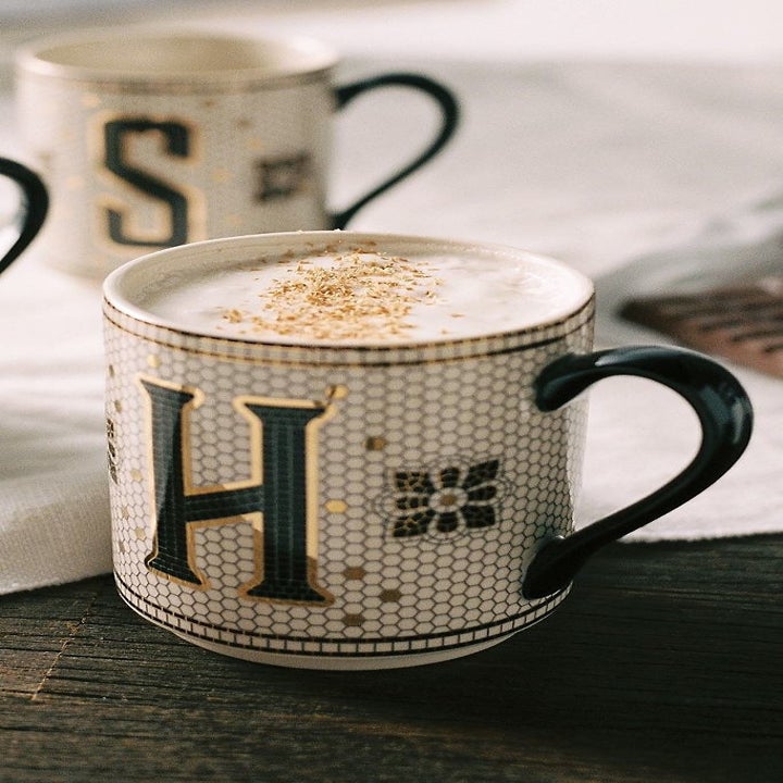 Monogram mug with tiled pattern and the letter H