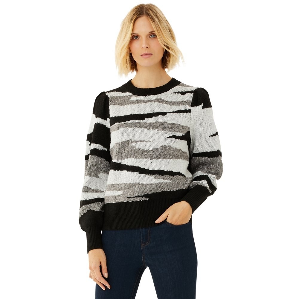 model wears black and white camo print sweater
