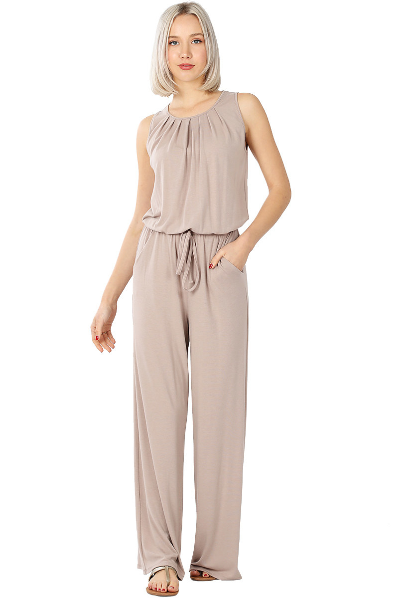 model wears sleeveless tan colored jumpsuit