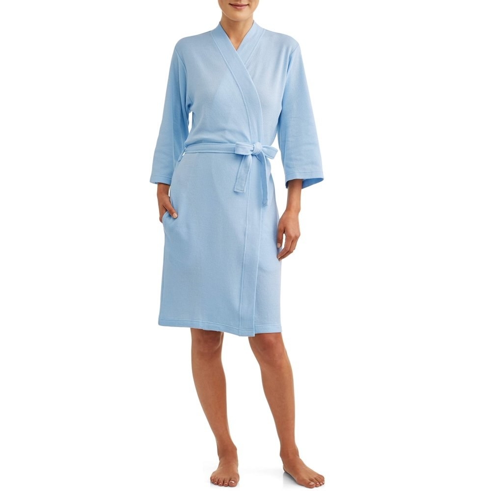 model wears waffle knit blue colored robe