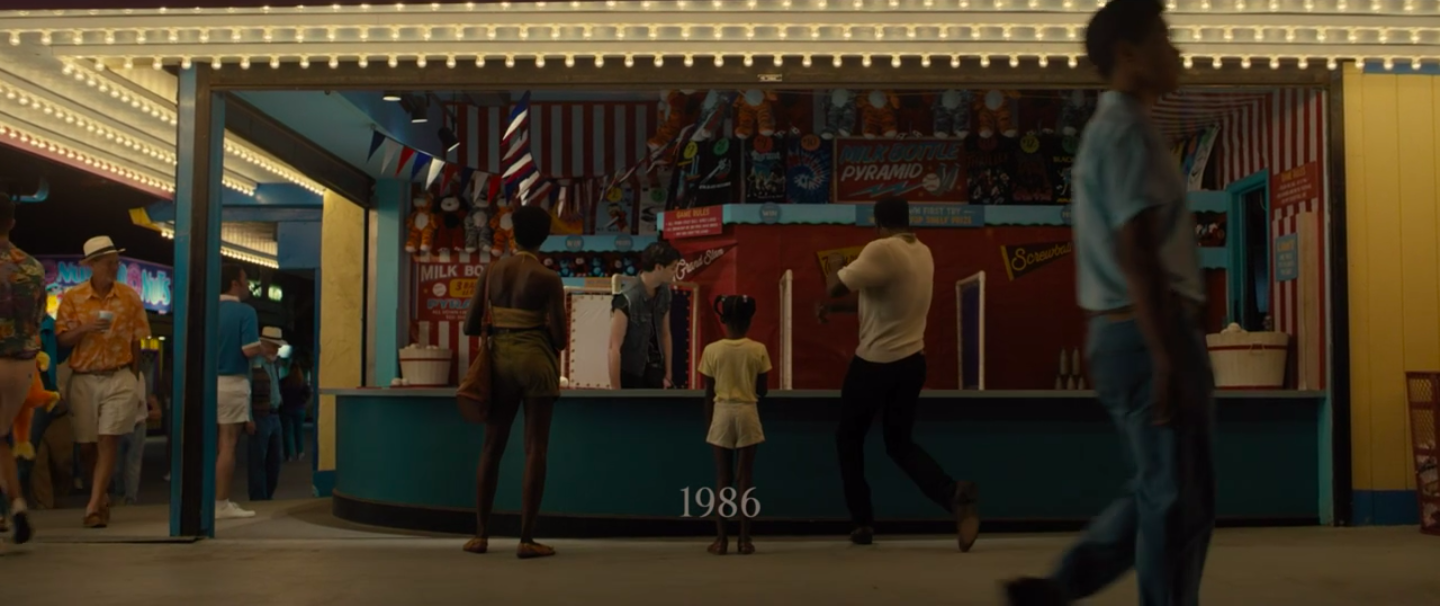 A young Adeline and her parents play a carnival game