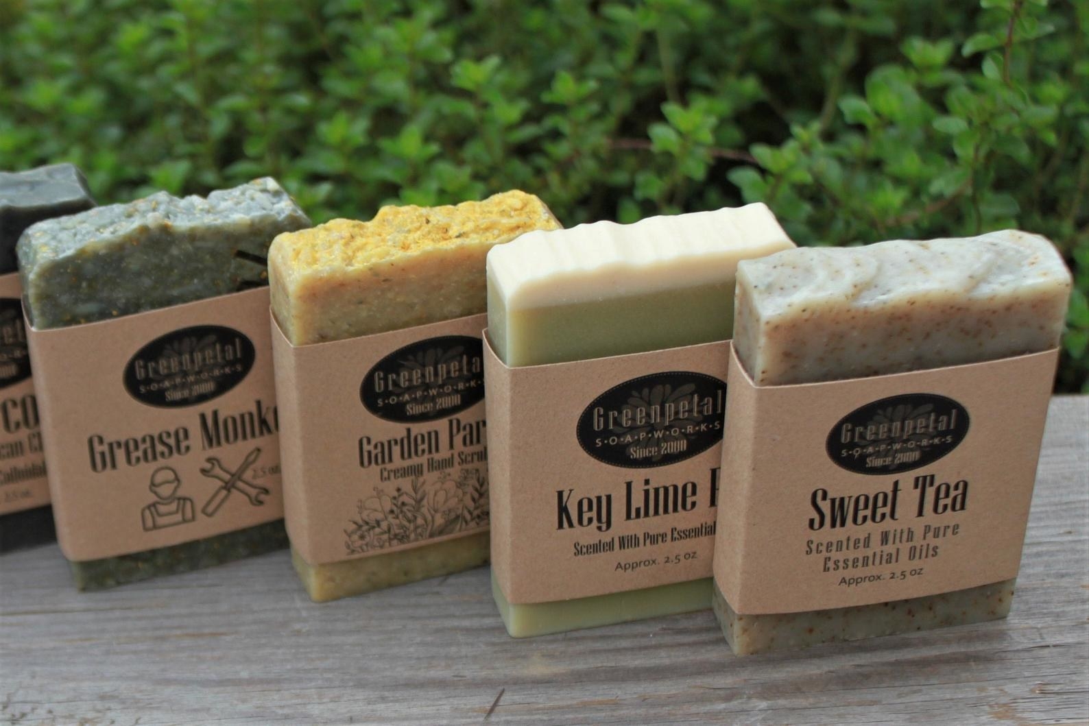 four soaps lined up that are named grease monkey, garden party, key lime, and sweet tea