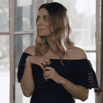 a gif of alexis from schitt&#x27;s creek looking excited