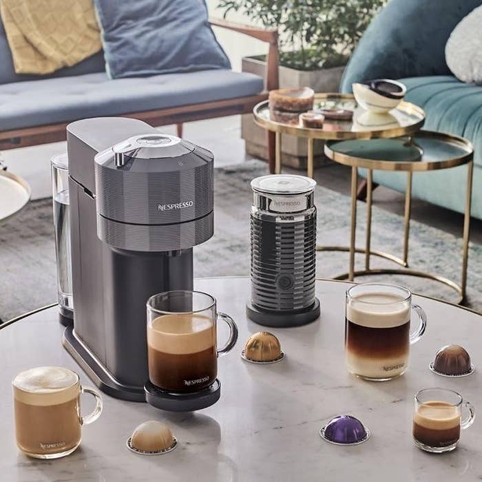 The Nespresso machine making frothy cappuccino