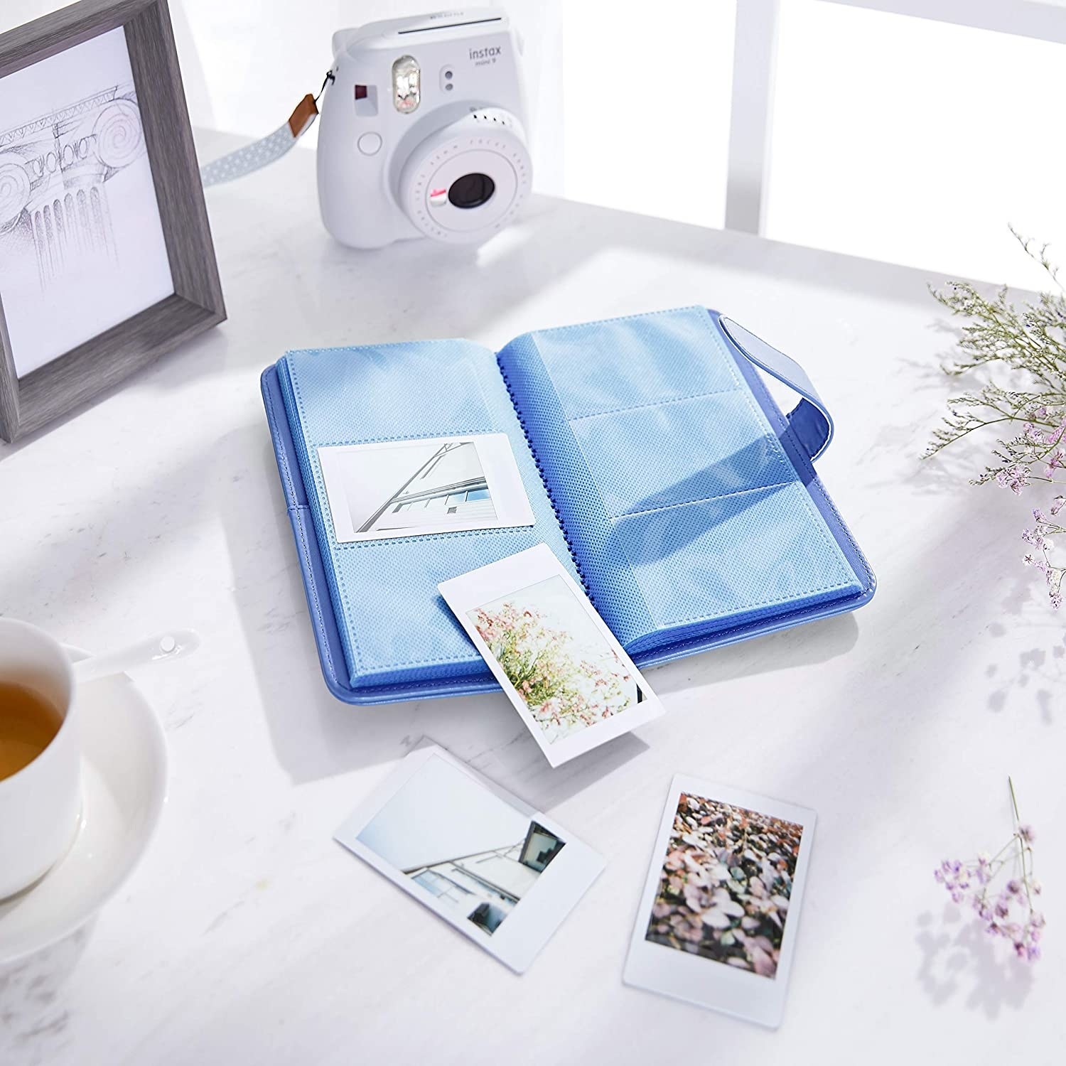 The album surrounded by photos