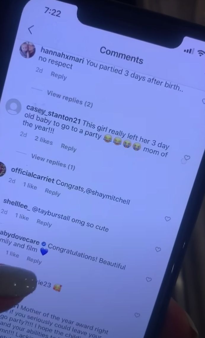 Shay scrolls through numerous comments on Instagram