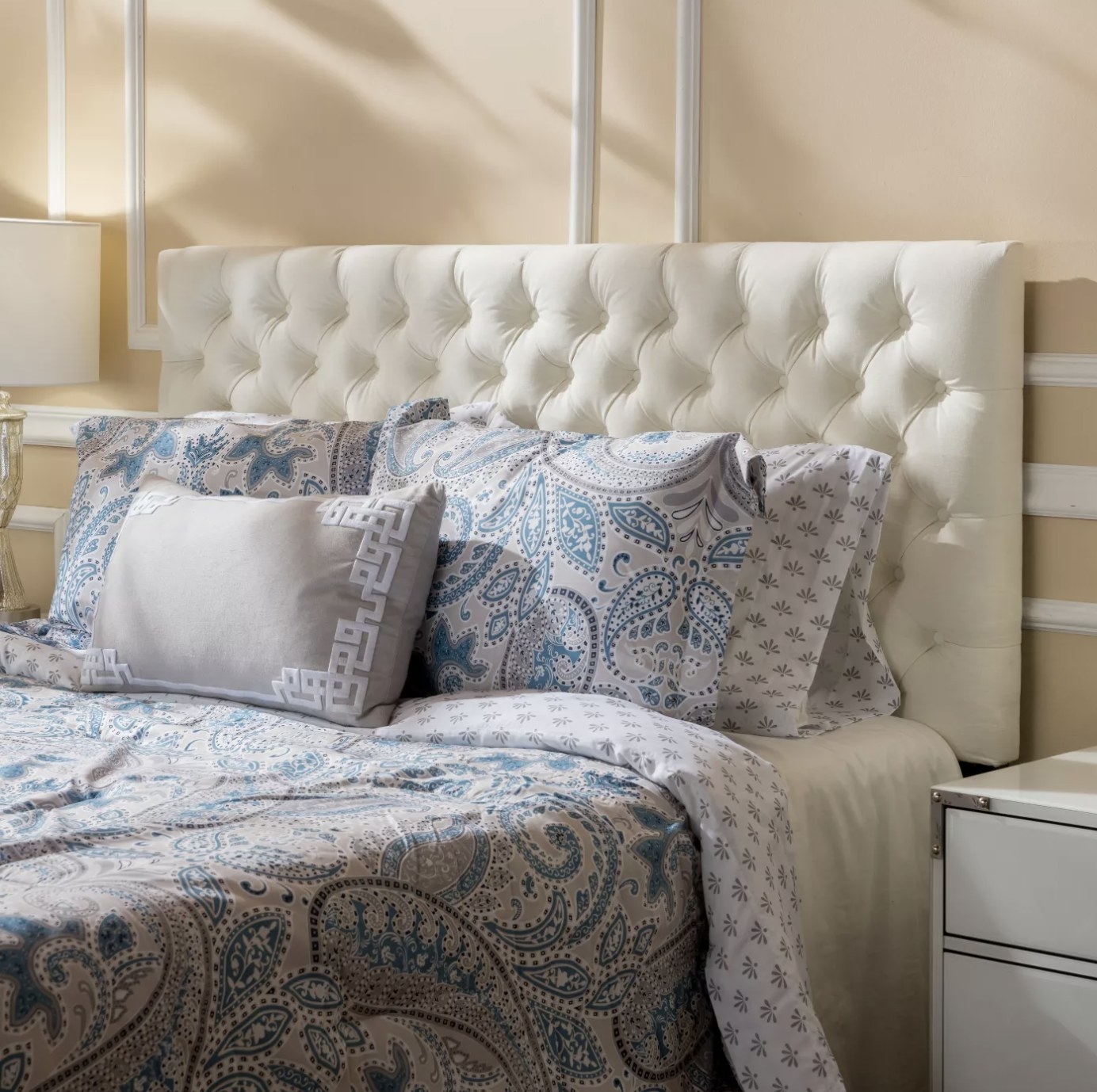 The white tufted headboard