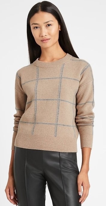 model wearing tan sweater with grey details