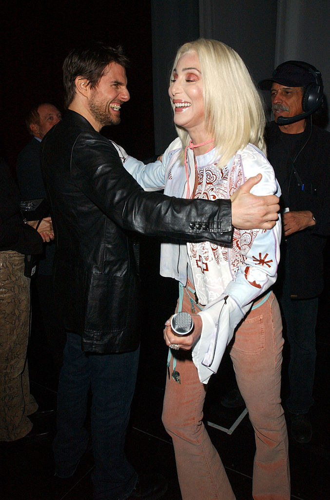 Tom Cruise and Cher laughing and embracing