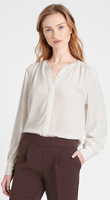 model wearing white blouse 