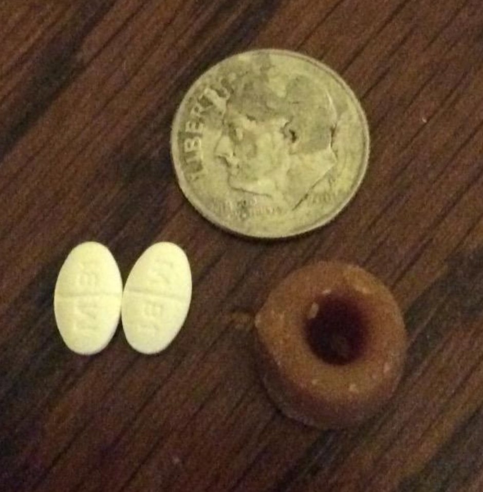 Reviewer photo of pills next to treats