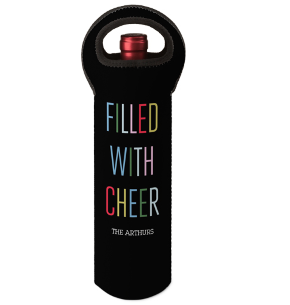 a black neoprene wine tote with a handle and the words filled with cheer on it in different colors