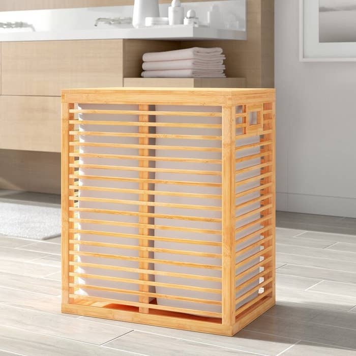The bamboo laundry hamper with canvas liners