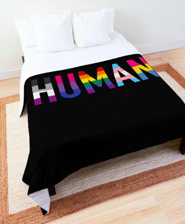 a black blanket with the words Human with each letter of the word the colors of a different pride flag