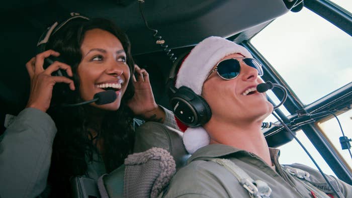 Erica and Andrew flying in Operation Christmas Drop