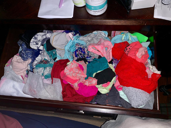 Reviewer's messy drawer packed with bras and underwear