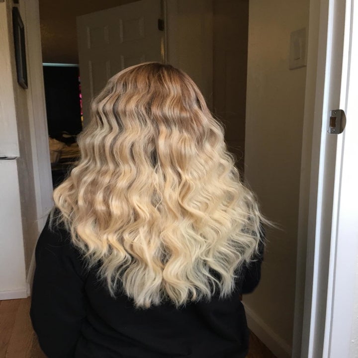 The same reviewer with wavy hair after using the tool