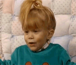A gif of Michelle Tanner from Full House being excited