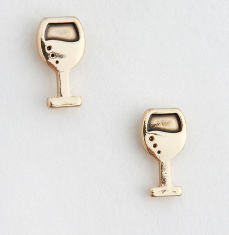 A pair of stamped earrings with champagne