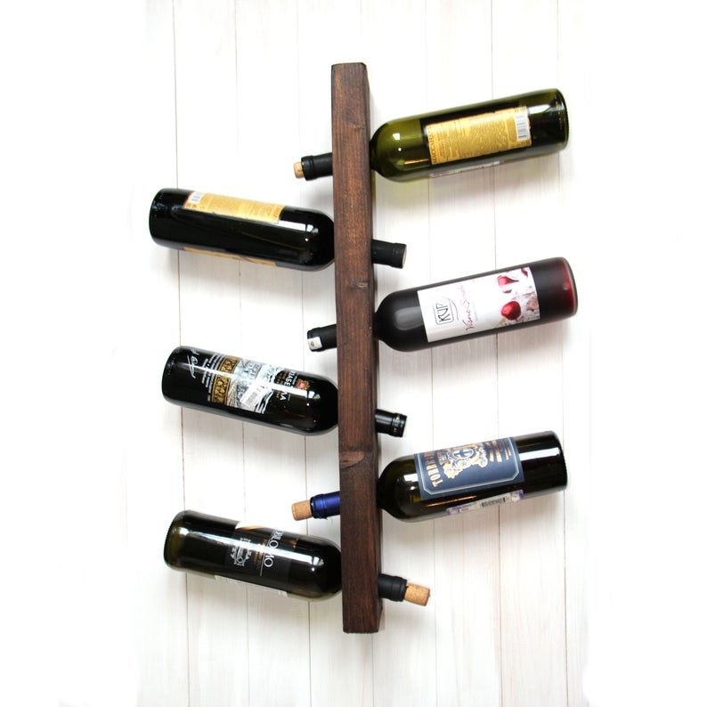 A wine bottle holder with the bottles at an angle