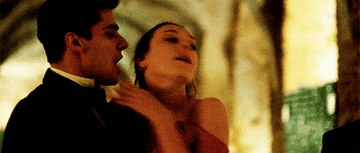A GIF of Carla kissing Polo and Christian in a scene from &quot;Elite&quot;