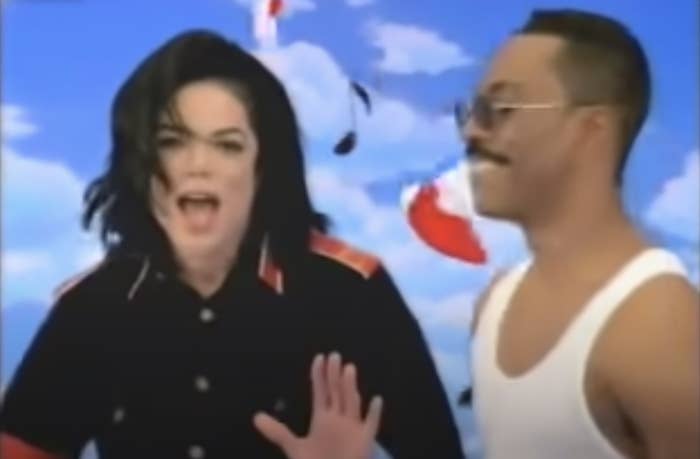 1990s era Michael Jackson sings in the video next to a tank-top wearing Eddie Murphy