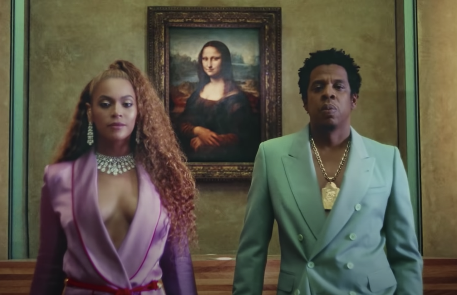 Beyoncé and  Jay Z stand side by side in the Apeshit video