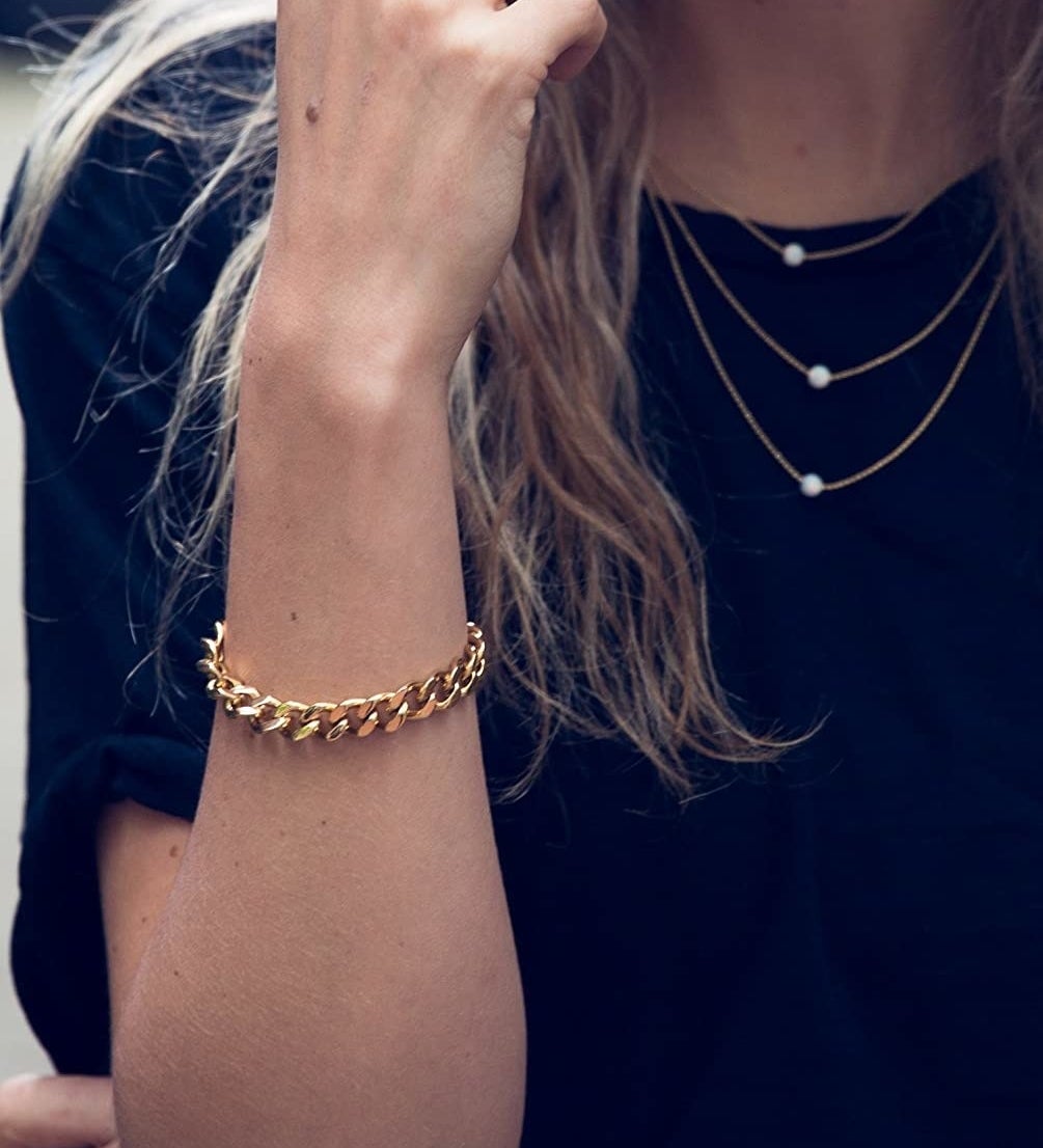 model wearing the gold chain bracelet 